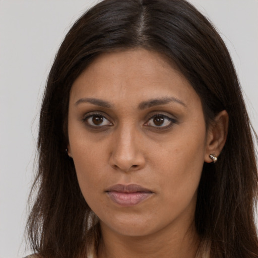 Neutral black young-adult female with long  brown hair and brown eyes