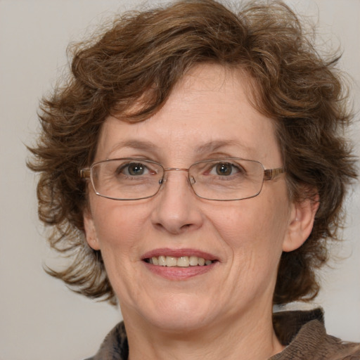 Joyful white middle-aged female with medium  brown hair and brown eyes