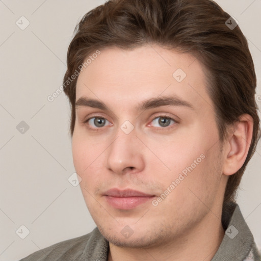 Neutral white young-adult male with short  brown hair and grey eyes