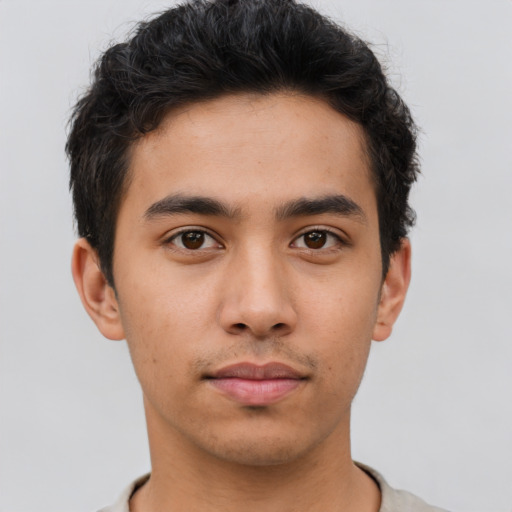 Neutral asian young-adult male with short  brown hair and brown eyes