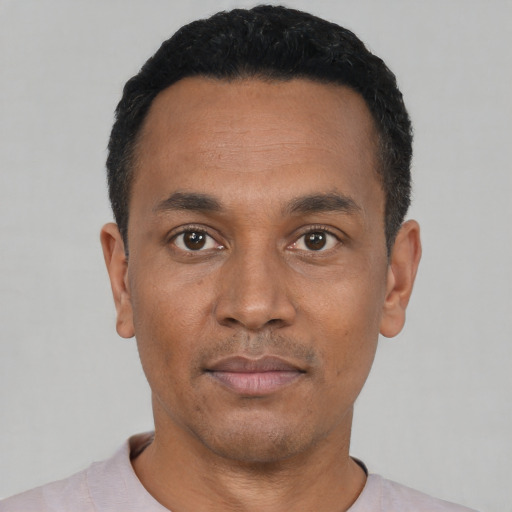 Neutral black young-adult male with short  black hair and brown eyes