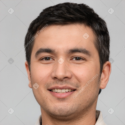 Joyful white young-adult male with short  black hair and brown eyes