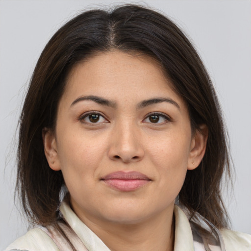 Joyful white young-adult female with medium  brown hair and brown eyes