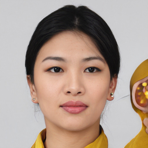 Neutral asian young-adult female with medium  black hair and brown eyes