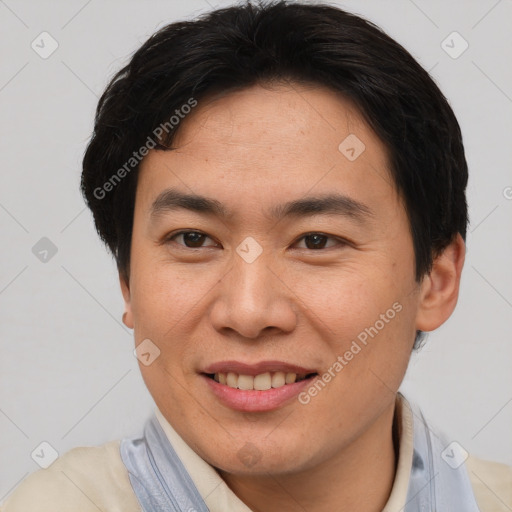 Joyful asian young-adult male with short  brown hair and brown eyes