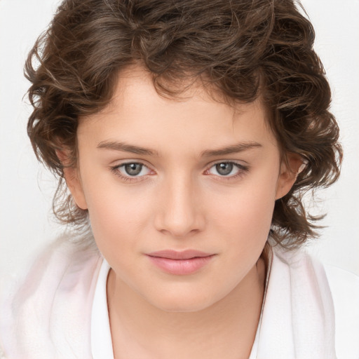 Joyful white child female with medium  brown hair and brown eyes