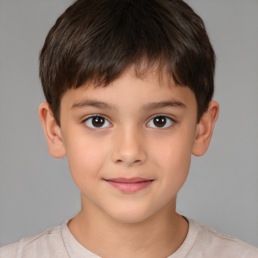 Joyful white child male with short  brown hair and brown eyes