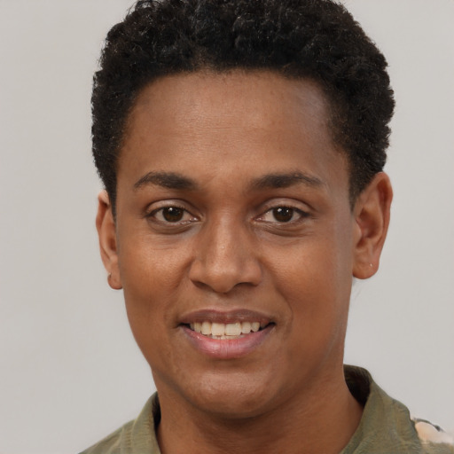 Joyful black young-adult female with short  black hair and brown eyes