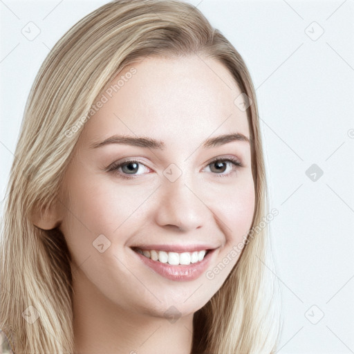 Joyful white young-adult female with long  brown hair and blue eyes