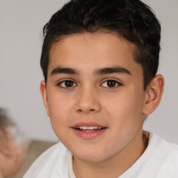 Joyful white child male with short  brown hair and brown eyes