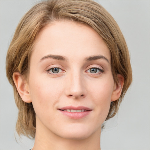 Joyful white young-adult female with medium  brown hair and blue eyes