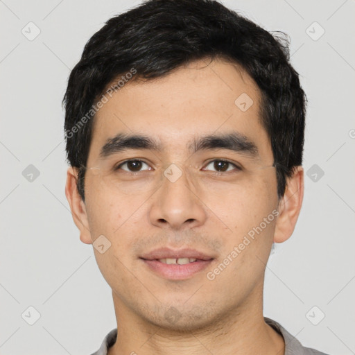 Joyful asian young-adult male with short  black hair and brown eyes