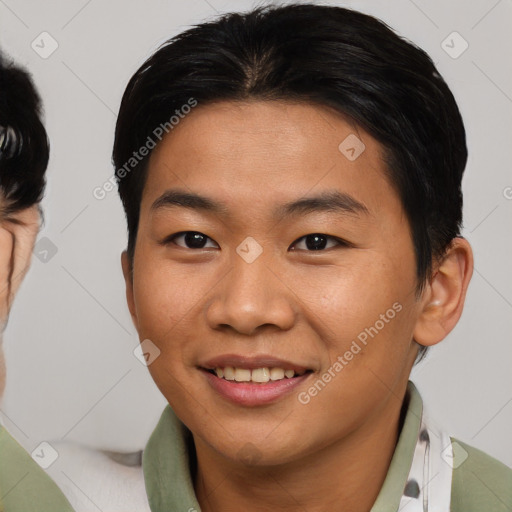 Joyful asian young-adult male with short  brown hair and brown eyes