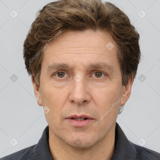 Joyful white adult male with short  brown hair and grey eyes