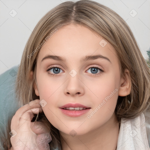 Joyful white child female with medium  brown hair and grey eyes