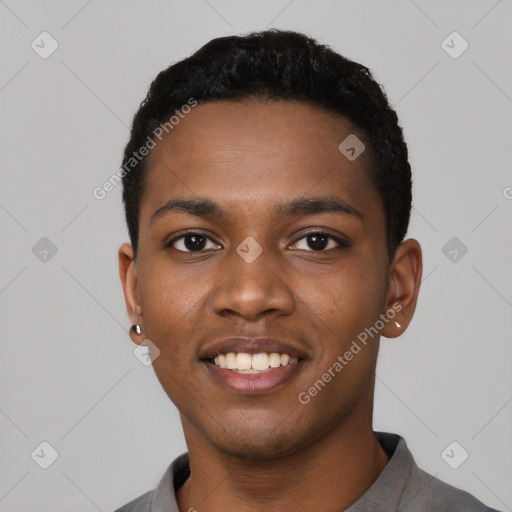 Joyful black young-adult male with short  black hair and brown eyes