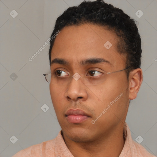 Neutral white young-adult male with short  black hair and brown eyes