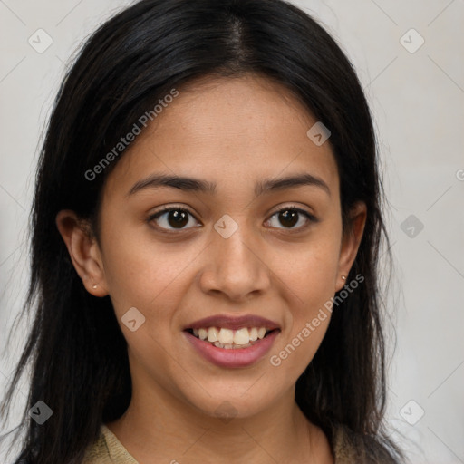 Joyful latino young-adult female with long  brown hair and brown eyes