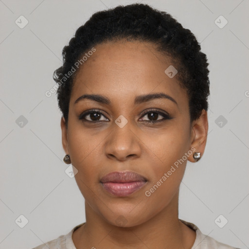 Joyful black young-adult female with short  black hair and brown eyes