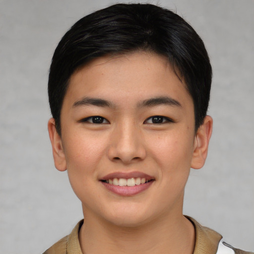 Joyful asian young-adult female with short  brown hair and brown eyes