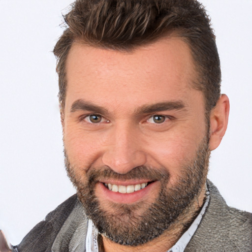 Joyful white adult male with short  brown hair and brown eyes