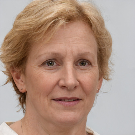 Joyful white middle-aged female with medium  brown hair and brown eyes