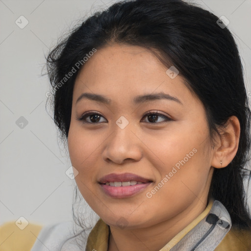 Joyful latino young-adult female with medium  brown hair and brown eyes