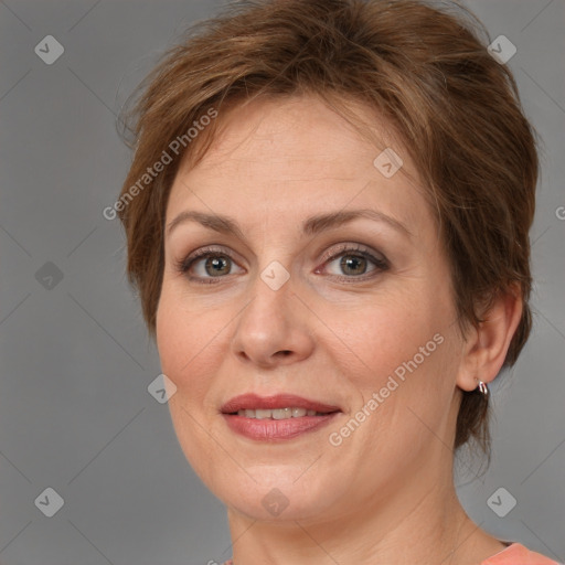 Joyful white adult female with medium  brown hair and grey eyes