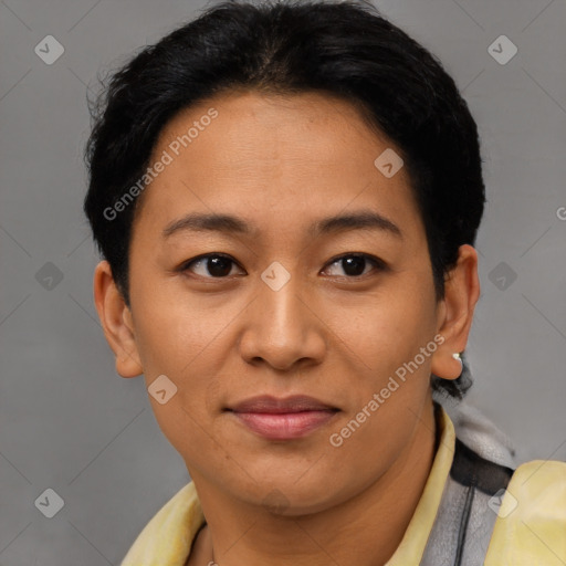 Joyful latino adult female with short  brown hair and brown eyes