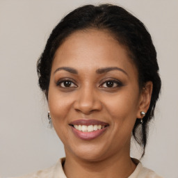 Joyful latino young-adult female with medium  brown hair and brown eyes