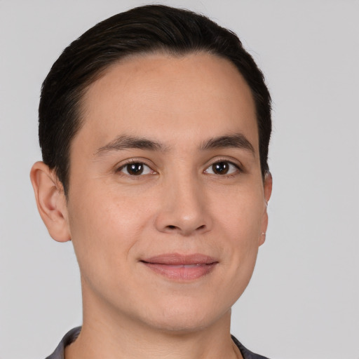 Joyful white young-adult male with short  brown hair and brown eyes