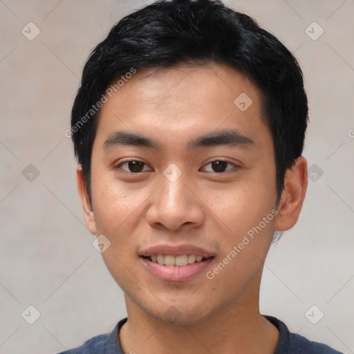 Joyful asian young-adult male with short  black hair and brown eyes