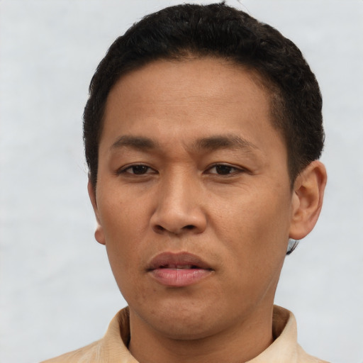 Neutral white adult male with short  black hair and brown eyes