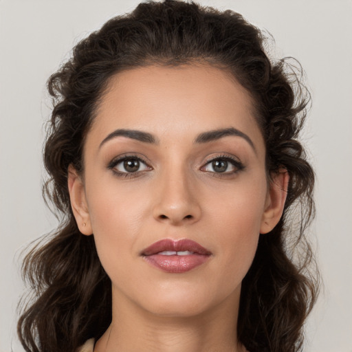 Joyful white young-adult female with long  brown hair and brown eyes