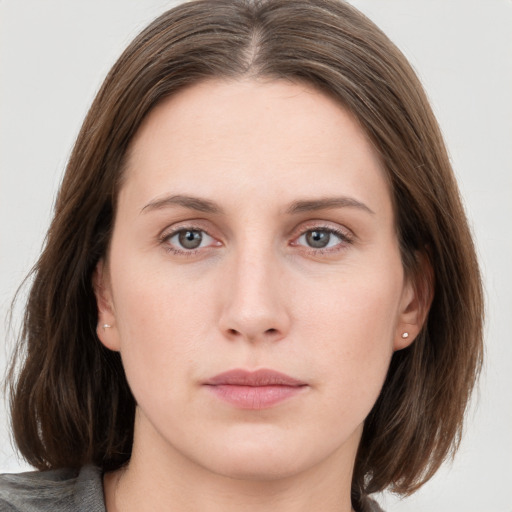 Neutral white young-adult female with medium  brown hair and grey eyes