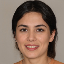 Joyful white young-adult female with medium  brown hair and brown eyes