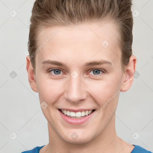 Joyful white young-adult female with short  brown hair and grey eyes