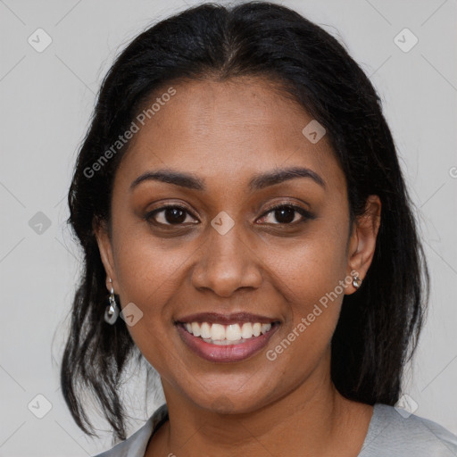 Joyful black young-adult female with medium  brown hair and brown eyes