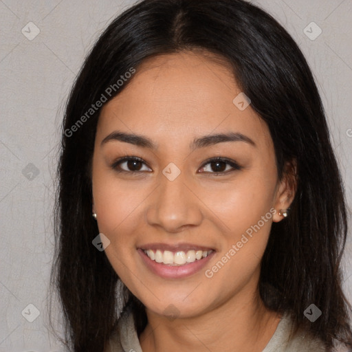 Joyful latino young-adult female with long  brown hair and brown eyes