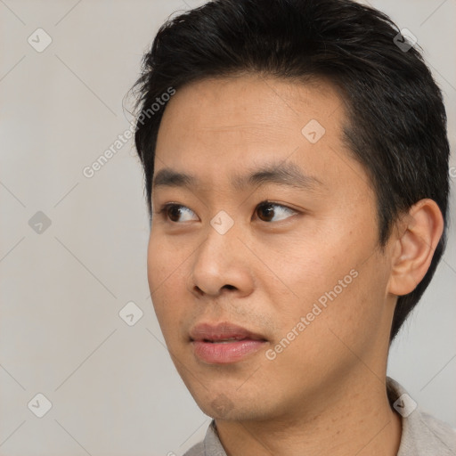 Neutral asian young-adult male with short  black hair and brown eyes