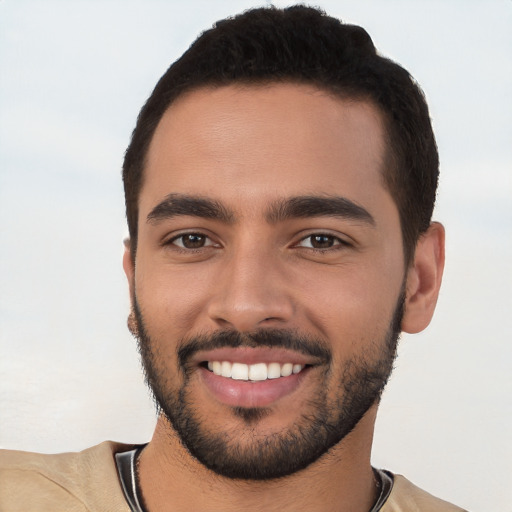 Joyful white young-adult male with short  black hair and brown eyes