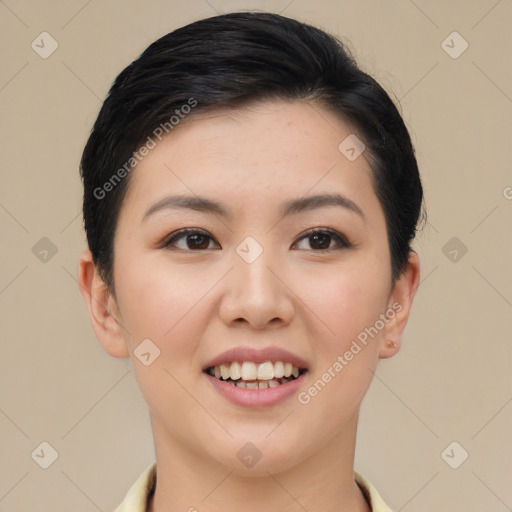 Joyful asian young-adult female with short  black hair and brown eyes