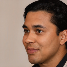 Joyful latino young-adult male with short  black hair and brown eyes