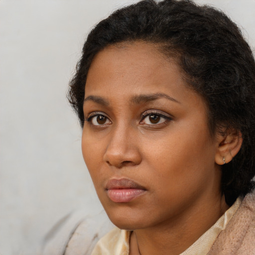Neutral black young-adult female with short  brown hair and brown eyes