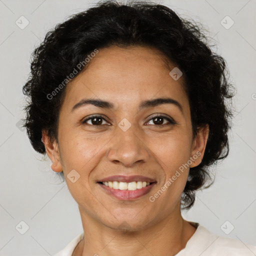 Joyful latino adult female with short  brown hair and brown eyes