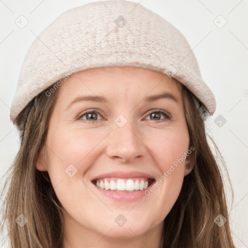 Joyful white young-adult female with long  brown hair and brown eyes