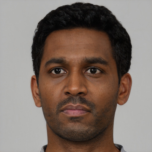 Neutral black young-adult male with short  black hair and brown eyes