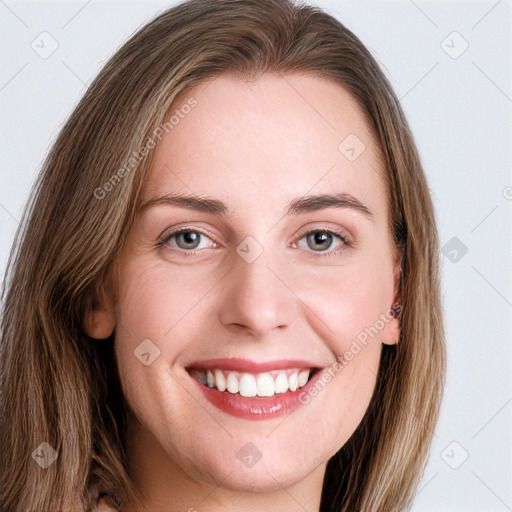 Joyful white young-adult female with long  brown hair and blue eyes