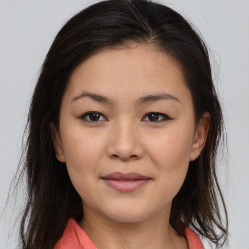 Joyful asian young-adult female with medium  brown hair and brown eyes