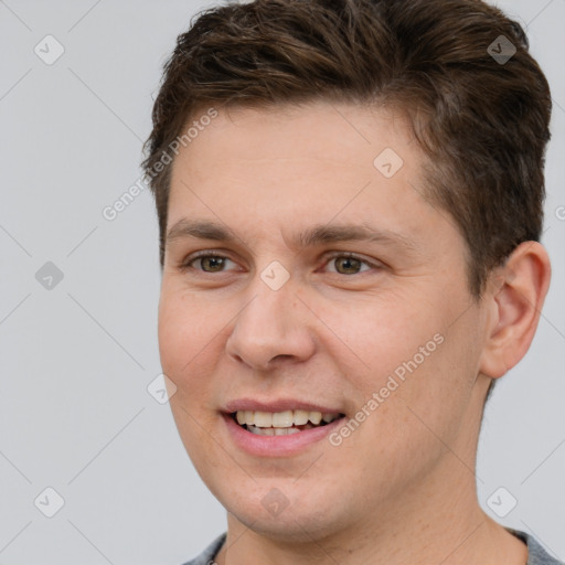 Joyful white young-adult male with short  brown hair and brown eyes